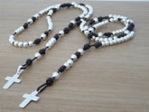 Rosario de plata y cuero